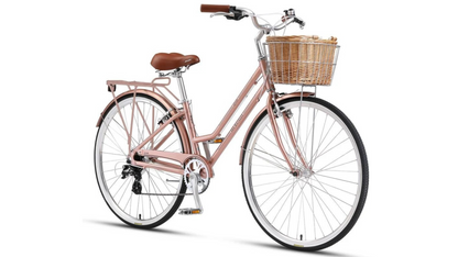 Pink bicycle with a basket on a white background