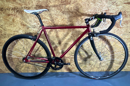 Red bicycle on a wooden floor