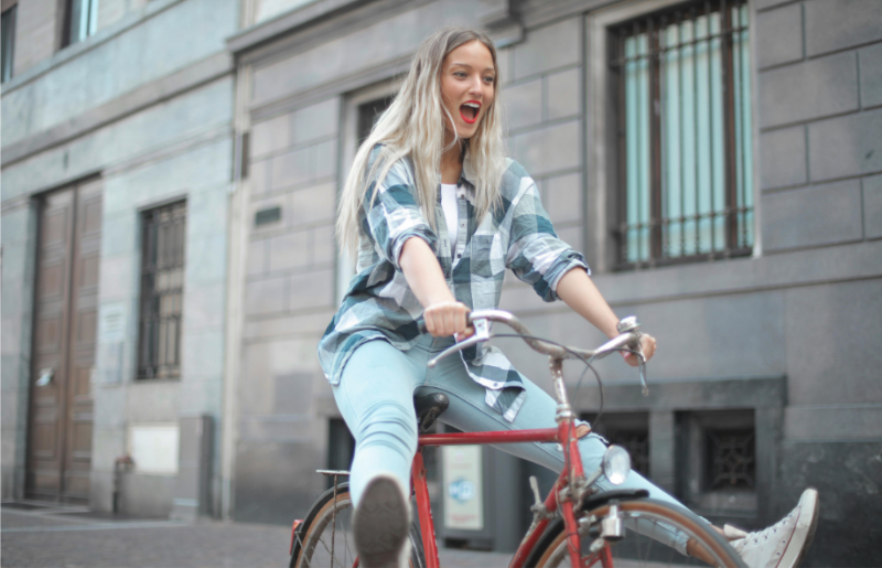 Woman riding a bicycle in an urban setting