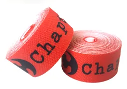 Two rolls of red tape with black text on a white background